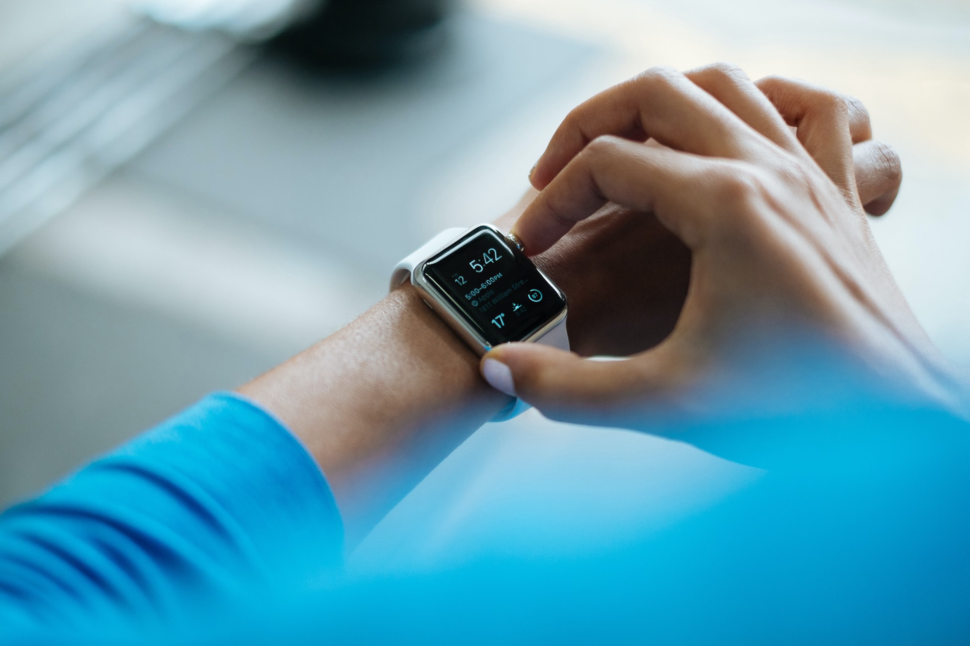 woman checking fitbit